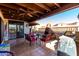 Covered patio with fireplace and outdoor seating at 26223 N Bravo Ln, Rio Verde, AZ 85263