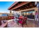 Outdoor patio with seating area, built-in grill, and fire pit at 26223 N Bravo Ln, Rio Verde, AZ 85263