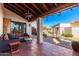 Covered patio with seating area and view of backyard at 26223 N Bravo Ln, Rio Verde, AZ 85263