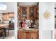 Wet bar with a copper sink and bird-themed wallpaper at 26223 N Bravo Ln, Rio Verde, AZ 85263