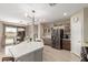 Modern kitchen with island and stainless steel appliances at 30636 N Royal Oak Way, San Tan Valley, AZ 85143