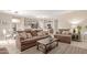 Open living space with a view into the kitchen and dining area at 30636 N Royal Oak Way, San Tan Valley, AZ 85143