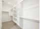 Spacious walk-in closet with ample shelving and metal hanging rods at 4820 N 177Th Dr, Goodyear, AZ 85395