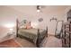 Cozy bedroom with an ornate bed frame and ample closet space at 7625 E Camelback Rd # B116, Scottsdale, AZ 85251