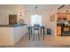 Dining area with breakfast bar and kitchen access at 7625 E Camelback Rd # B116, Scottsdale, AZ 85251