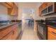 Kitchen with granite countertops and wood cabinets at 7625 E Camelback Rd # B116, Scottsdale, AZ 85251