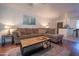 Relaxing living room with L-shaped sofa and a view into the kitchen at 7625 E Camelback Rd # B116, Scottsdale, AZ 85251