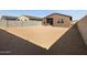 Dirt backyard with privacy wall at 8657 W Warner St, Tolleson, AZ 85353