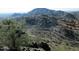 Aerial view of a mountainous lot with city views and terraced hillside at 10653 N 10Th Pl, Phoenix, AZ 85020