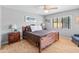 Spacious bedroom with hardwood floors and a ceiling fan at 10653 N 10Th Pl, Phoenix, AZ 85020