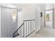 Upstairs hallway with chandelier and carpet flooring at 10653 N 10Th Pl, Phoenix, AZ 85020