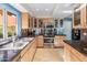 Modern kitchen featuring stainless steel appliances and granite countertops at 10653 N 10Th Pl, Phoenix, AZ 85020