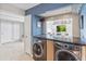 Updated laundry room with stackable washer and dryer, granite countertop at 10653 N 10Th Pl, Phoenix, AZ 85020