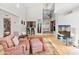 Bright living room with vaulted ceilings, hardwood floors, and a cozy seating area at 10653 N 10Th Pl, Phoenix, AZ 85020