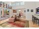 Open living and dining area with hardwood floors and a view to the pool at 10653 N 10Th Pl, Phoenix, AZ 85020