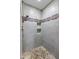 Large shower with pebble floor and tile surround at 10653 N 10Th Pl, Phoenix, AZ 85020