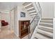 Staircase with wooden railing and carpet runner at 10653 N 10Th Pl, Phoenix, AZ 85020