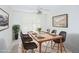 Well-lit dining room featuring a modern table setting with seating for six at 12422 W Ginger Dr, Sun City West, AZ 85375