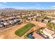 Aerial view of a residential neighborhood, showcasing homes and a golf course at 22821 S 212Th St, Queen Creek, AZ 85142