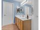 Clean bathroom with double sinks and light blue walls at 22821 S 212Th St, Queen Creek, AZ 85142
