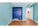 Bedroom with built-in closet and wood flooring at 22821 S 212Th St, Queen Creek, AZ 85142