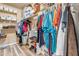 Large walk-in closet with ample shelving and hanging space at 22821 S 212Th St, Queen Creek, AZ 85142