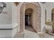 Stone-accented entryway with arched doorway leading into the home at 22821 S 212Th St, Queen Creek, AZ 85142