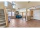 Home's entryway with staircase and a view into living area at 22821 S 212Th St, Queen Creek, AZ 85142