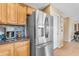 Stainless steel appliances and wood cabinets highlight this kitchen at 22821 S 212Th St, Queen Creek, AZ 85142