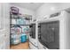 Bright laundry room with washer, dryer, and ample storage shelving at 22821 S 212Th St, Queen Creek, AZ 85142