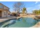 Refreshing pool with rock waterfall feature at 22821 S 212Th St, Queen Creek, AZ 85142