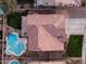 House and backyard aerial view, highlighting the roofline and pool at 25667 N 68Th Ln, Peoria, AZ 85383