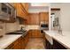 Well-equipped kitchen with stainless steel appliances and a stylish farmhouse sink at 33296 N Vanishing Trl, Scottsdale, AZ 85266