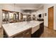Open-concept kitchen features a large island with seating and seamless access to living area at 33296 N Vanishing Trl, Scottsdale, AZ 85266