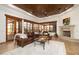 Inviting living area with french doors, a stone fireplace, and stylish decor at 33296 N Vanishing Trl, Scottsdale, AZ 85266