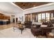 Spacious living area with abundant natural light, comfortable seating, and a view of the outdoor landscape at 33296 N Vanishing Trl, Scottsdale, AZ 85266