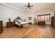 Spacious main bedroom boasts hardwood floors and ample natural light from the windows at 33296 N Vanishing Trl, Scottsdale, AZ 85266