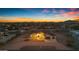 Aerial shot of a house at sunset, showcasing its exterior and landscaping at 433 W Saddle Mountain Road --, Phoenix, AZ 85086