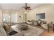 Bright living room with hardwood floors and staged furniture at 1209 W Fruit Tree Ln, San Tan Valley, AZ 85143