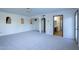 Large bedroom with carpet, ceiling fan and access to bathroom at 1302 E Steamboat Bend Dr, Tempe, AZ 85283