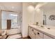 Bright bathroom with a bathtub, vanity, and large mirror at 13227 N Mimosa Dr # 109, Fountain Hills, AZ 85268