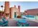 Community pool with adjacent seating and a unique building at 13227 N Mimosa Dr # 109, Fountain Hills, AZ 85268