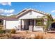 Single-story house with white garage door and desert landscaping at 15936 W Latham St, Goodyear, AZ 85338