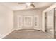 Bright bedroom featuring a ceiling fan and large window at 1672 E Augusta Ave, Chandler, AZ 85249