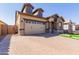 Two-story home with two car garage and landscaped yard at 19958 S 231St St, Queen Creek, AZ 85142