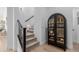 Modern staircase with black railing and carpeted steps at 19958 S 231St St, Queen Creek, AZ 85142