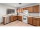 Functional kitchen featuring a stainless steel dishwasher, tile floors, and bright lighting at 2083 S 155Th Ln, Goodyear, AZ 85338