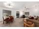 Open living space with dining area, modern lighting, and comfortable seating at 2083 S 155Th Ln, Goodyear, AZ 85338
