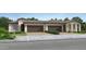 Charming single-story home featuring a tile roof, two-car garage, and inviting curb appeal at 24969 N 173Rd Ln, Surprise, AZ 85387