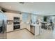 Open kitchen featuring stainless steel appliances, light countertops and a view to the dining area at 24969 N 173Rd Ln, Surprise, AZ 85387